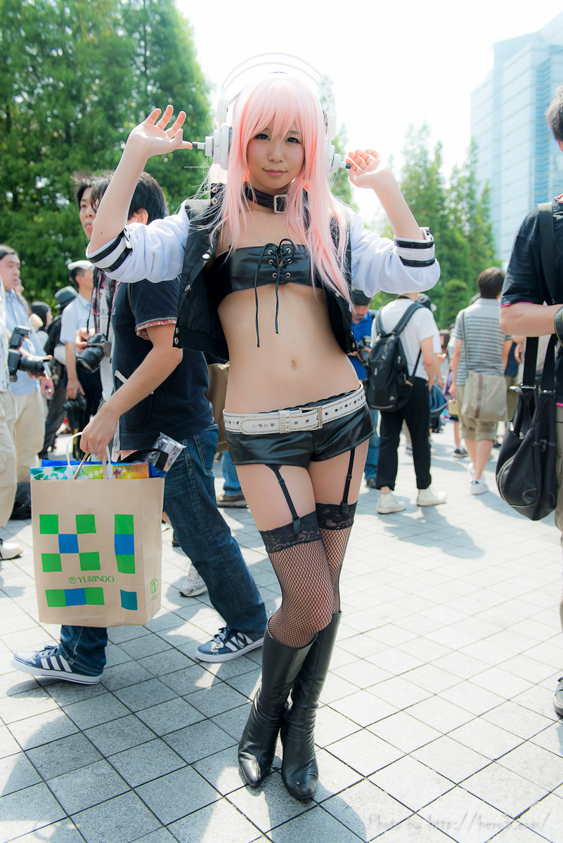 asian breasts cosplay female headphones long_hair midriff navel outside pink_hair solo watermark