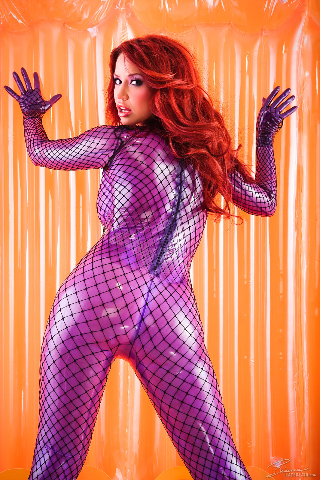 ass bianca_beauchamp breasts catsuit female gloves high_heels large_breasts long_hair looking_back red_hair see-through shoes solo watermark