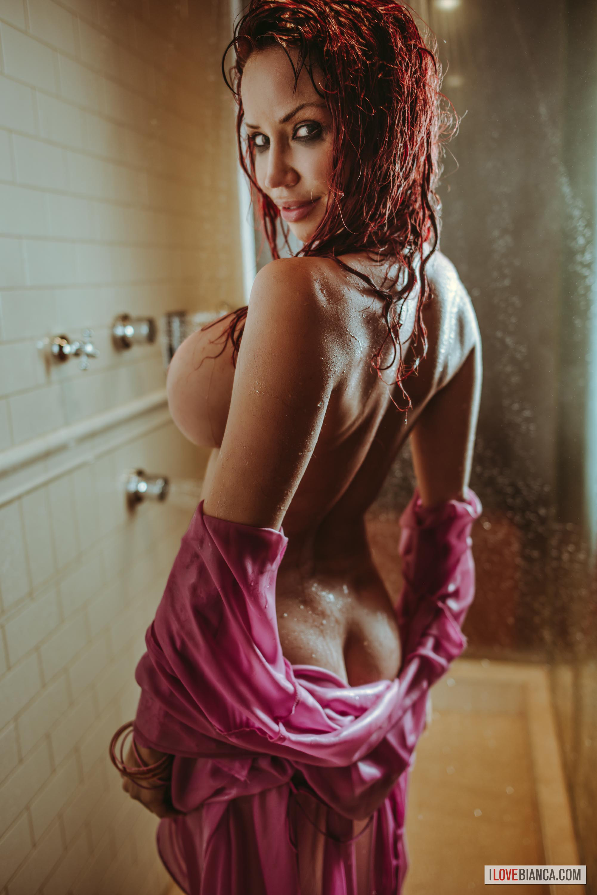 ass bianca_beauchamp breasts erect_nipples female large_breasts long_hair looking_back navel nipples red_hair shower solo water watermark wet wet_hair