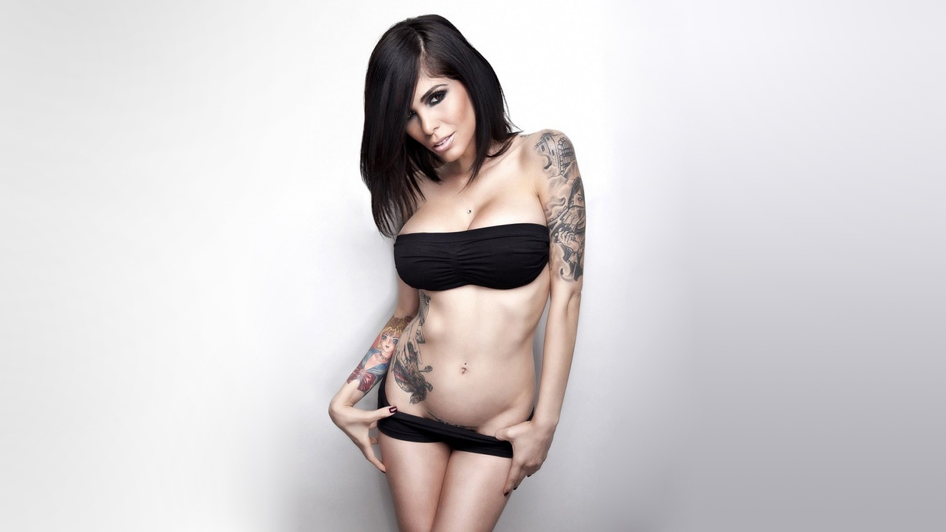 black_hair breasts cleavage female large_breasts long_hair midriff navel simple_background solo tattoo undressing