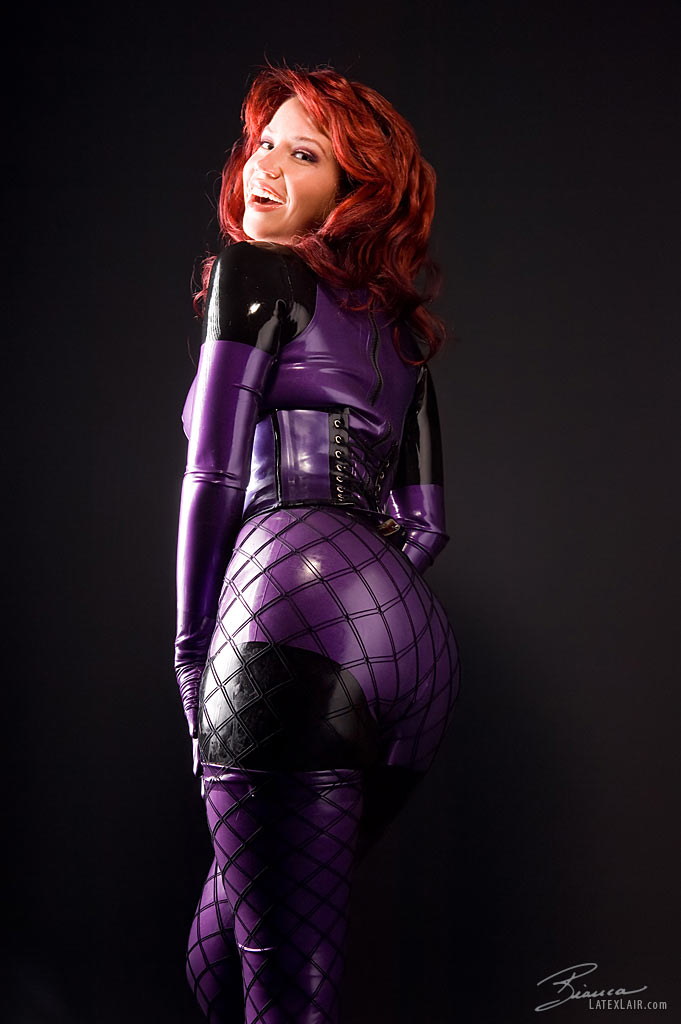 ass bianca_beauchamp breasts catsuit female gloves large_breasts latex long_hair looking_back red_hair simple_background solo watermark