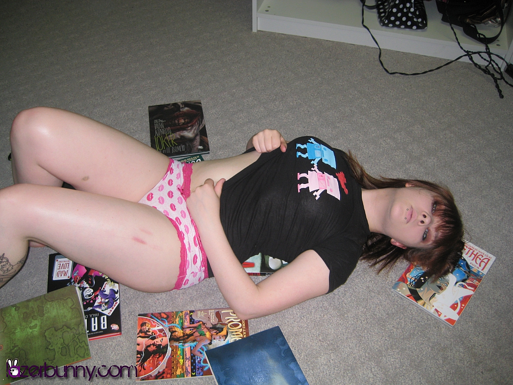 1girl breasts bruises comic_books female_focus female_only indoors large_breasts laying_on_back lip_piercing lying model_request non-nude non_nude on_floor panties photo piercing pink_panties sfw shirt solo solo_female solo_focus source_request suggestive tattoo thighs watermark