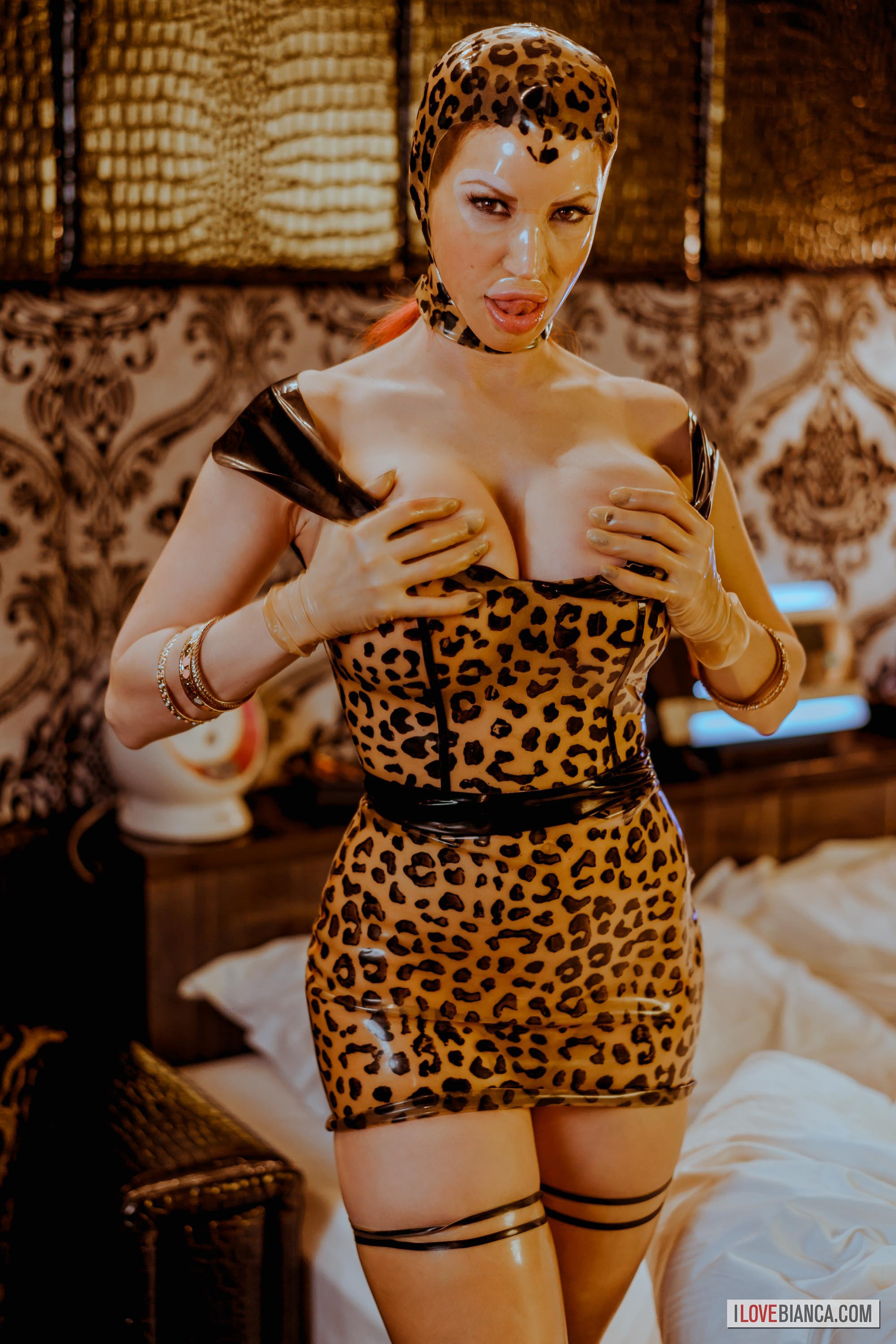 bed bianca_beauchamp breasts dress female high_heels large_breasts latex leopard_print long_hair mask red_hair shoes solo thighhighs watermark
