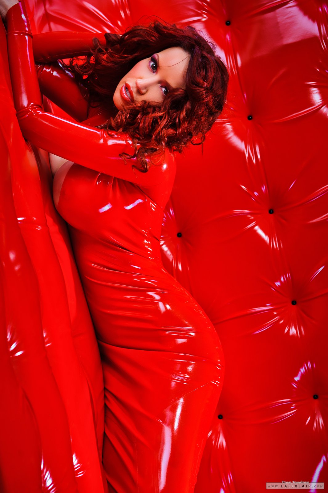 bianca_beauchamp breasts cleavage dress female high_heels large_breasts latex long_hair makeup necklace red_hair shoes solo watermark