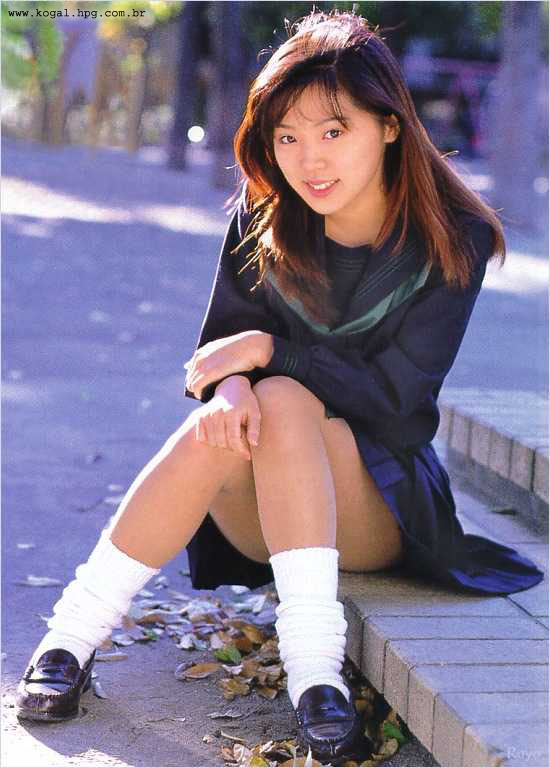 asian brown_eyes brown_hair japanese long_hair school_uniform schoolgirl seifuku sitting skirt smile solo