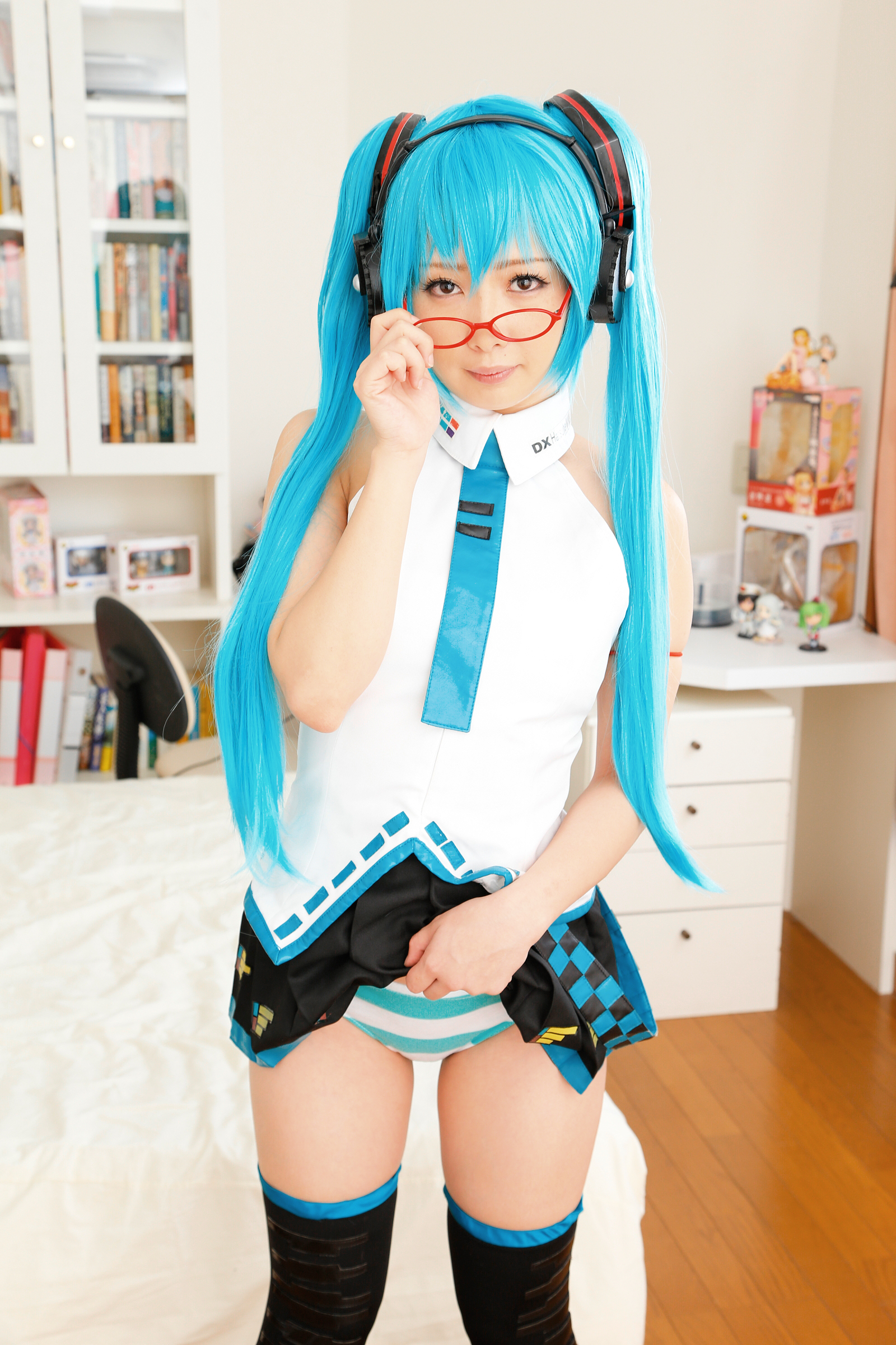 asian blue_hair cosplay female glasses headphones high_heels long_hair necktie shoes skirt socks solo