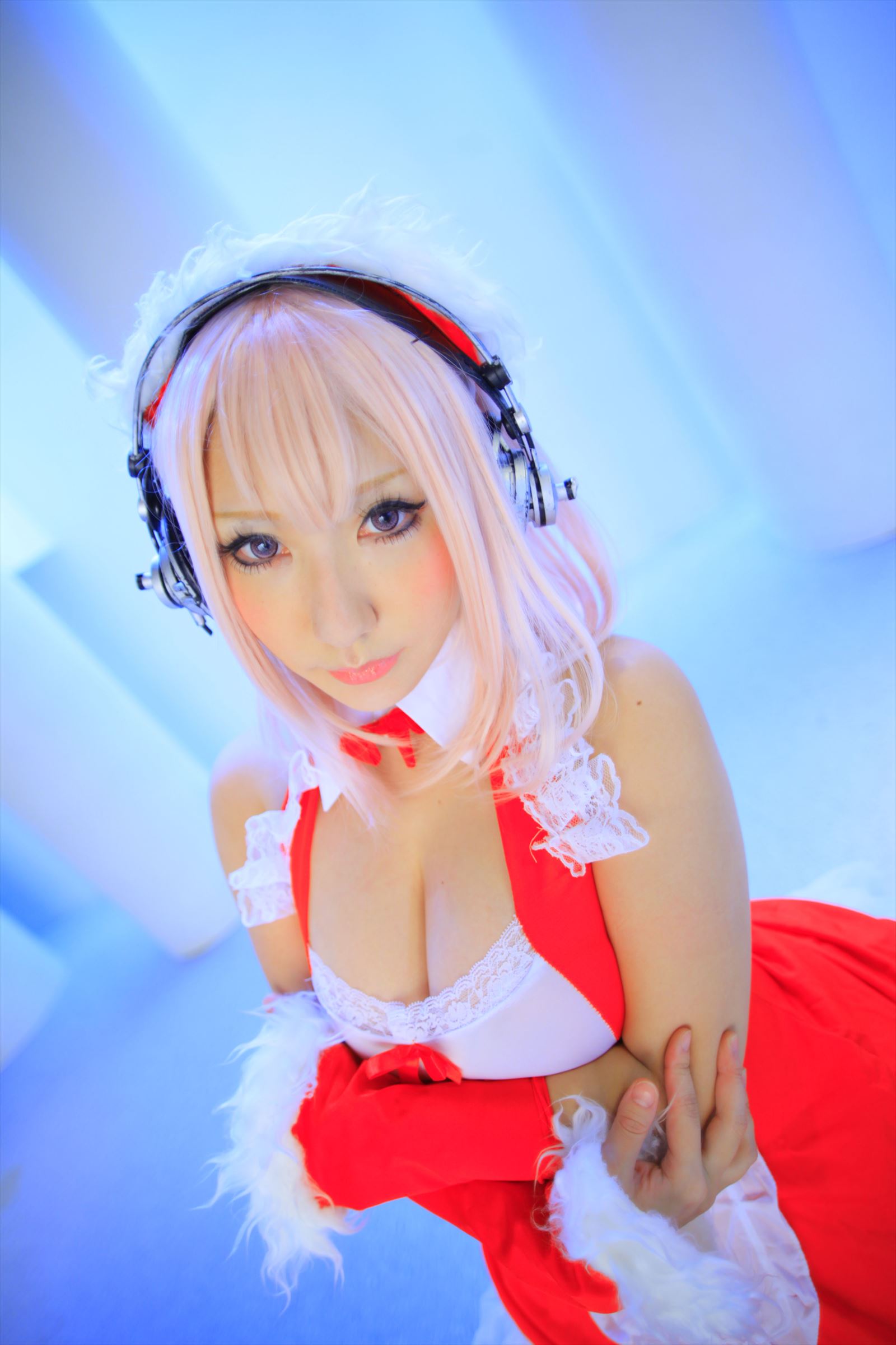 1girl asian breasts cosplay female headphones japanese large_breasts long_hair pink_hair shooting_star solo super_sonico
