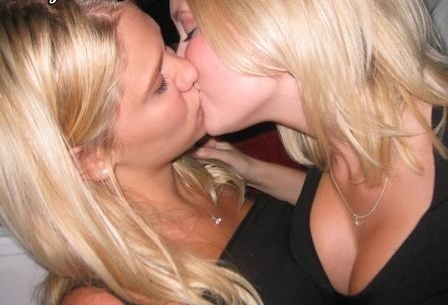 2girls bare_shoulders black_dress blonde blonde_hair breasts cleavage closed_eyes dress earrings female female_only hair jewelry kissing lesbian multiple_girls neck necklace photo real_person tank_top upper_body