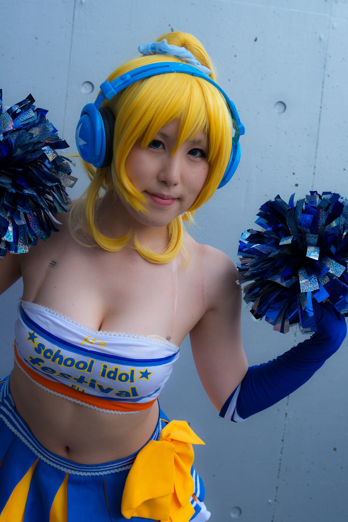 1girl asian ayase_eli bare_shoulders blonde_hair breasts cleavage cosplay elbow_gloves female gloves headphones long_hair love_live! love_live!_school_idol_project midriff navel pom_poms ponytail simple_background skirt solo wig