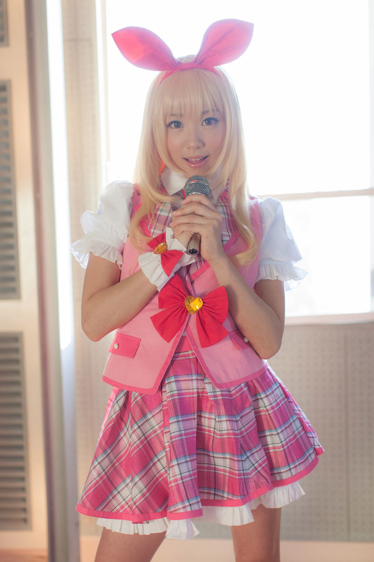 asian blonde_hair breasts cosplay female long_hair microphone shoes skirt solo