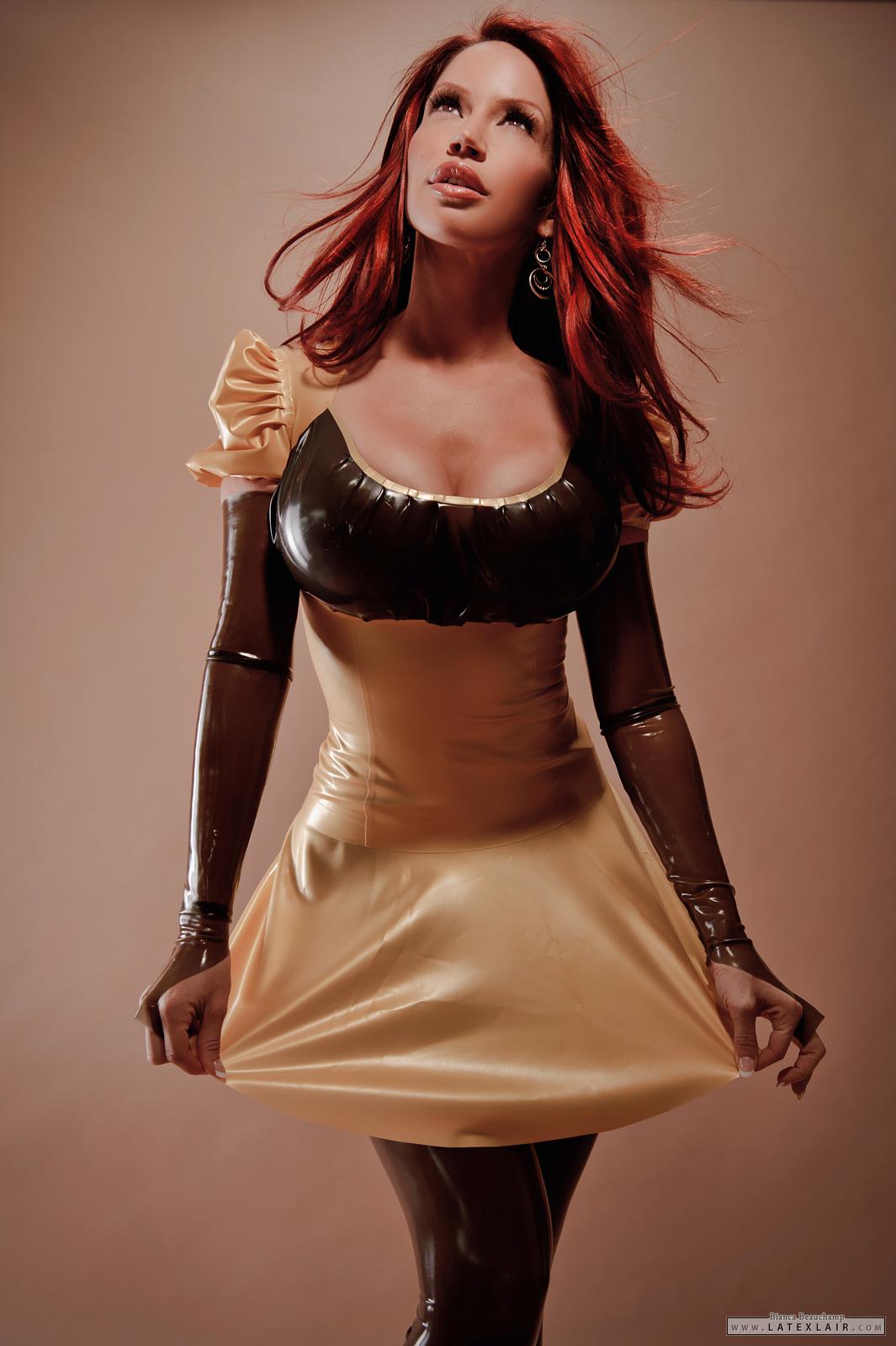 bianca_beauchamp breasts cleavage dress female high_heels large_breasts latex long_hair red_hair shoes simple_background solo watermark