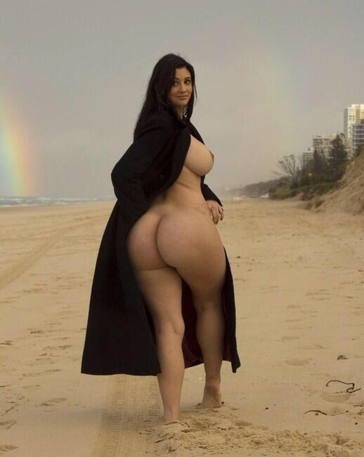 1girl arab ass beach breasts dark_hair dark_skin dat_ass feet female female_only looking_back nipples outside partially_clothed photoshop rainbow scarlett_morgan soles solo