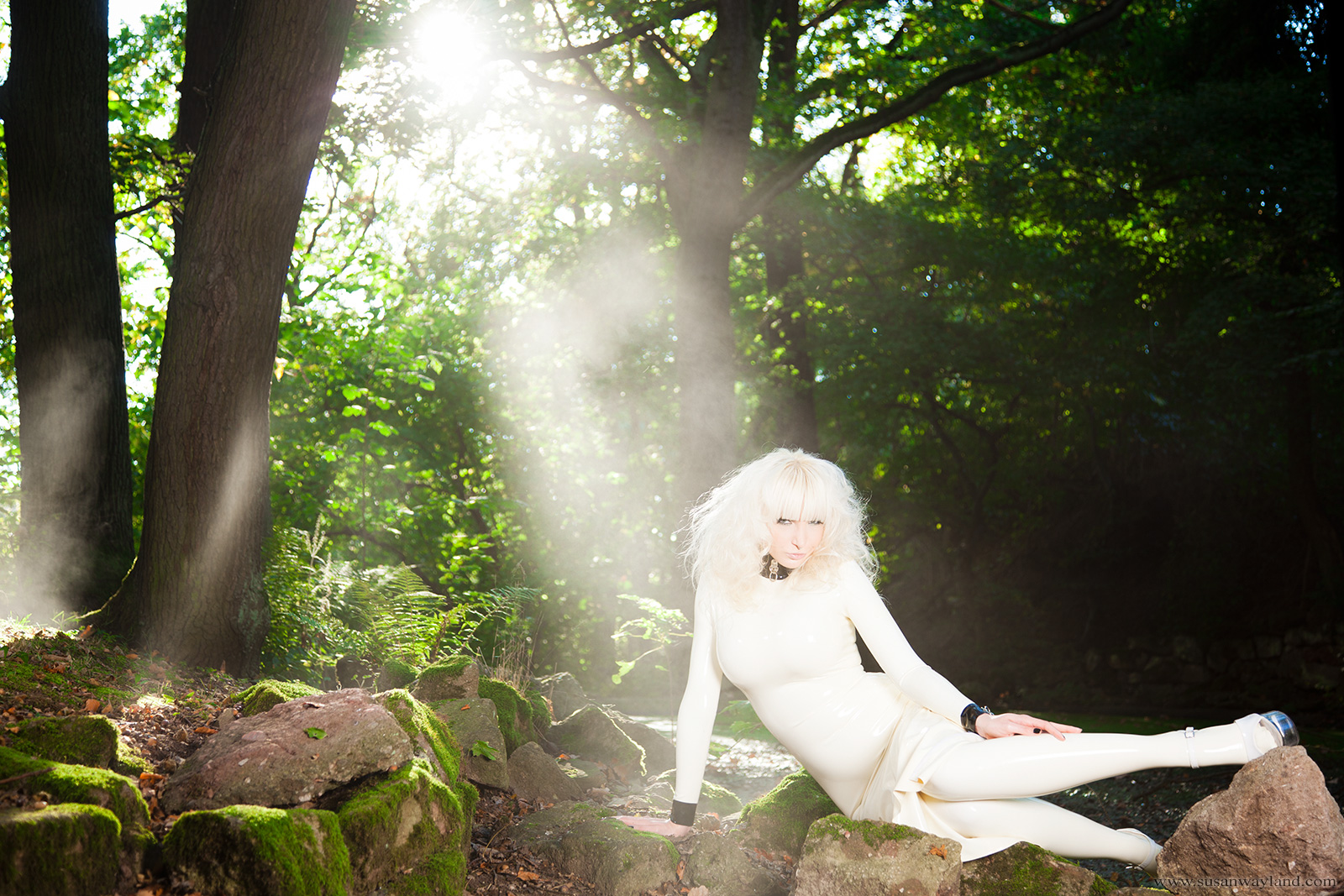 blonde_hair breasts dress female forest large_breasts latex long_hair outside solo susan_wayland watermark