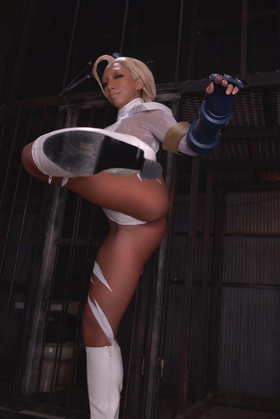 1girl asian ass blonde_hair body_paint breasts cammy_white clothed cosplay dark_skin fake_nails female female_only gloves hat knee_boots leotard long_hair looking_at_viewer non-nude nonsummerjack posing solo thong thong_leotard