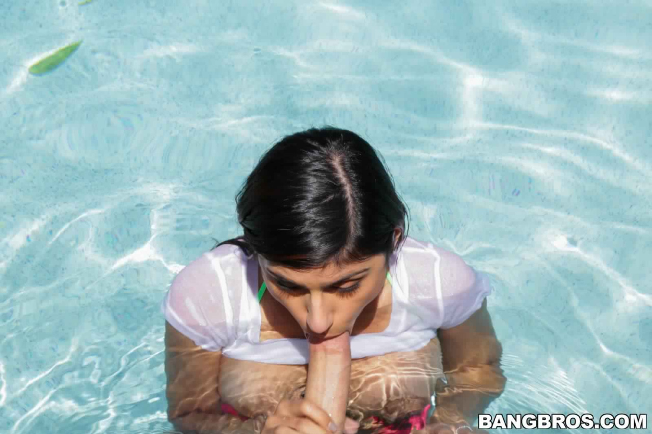 breasts brown_eyes brown_hair fellatio female lebanese_american male mia_khalifa penis pool tan_skin text watermark wet