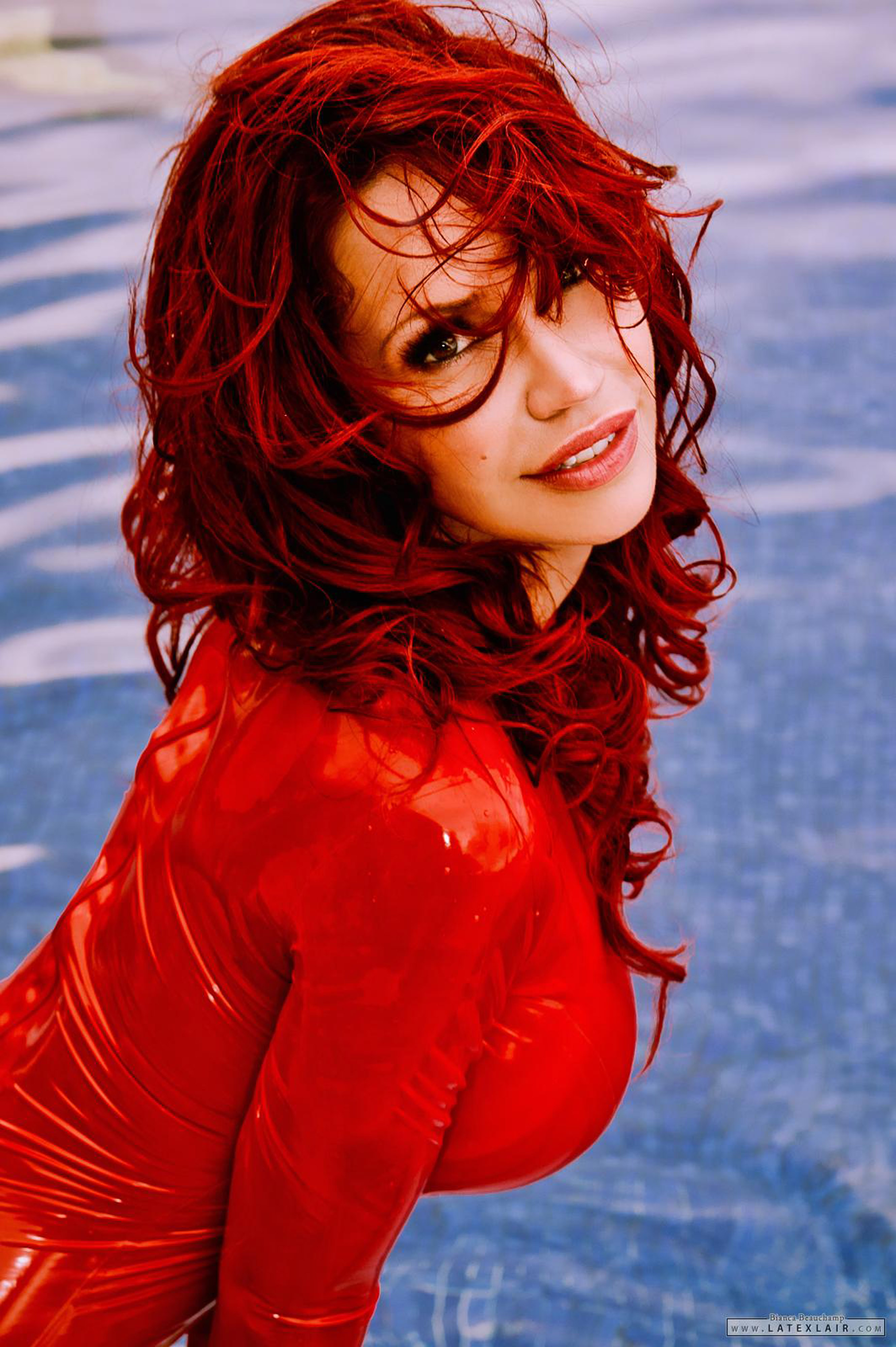 bianca_beauchamp bodysuit breasts female large_breasts latex long_hair outside red_hair solo water watermark wet
