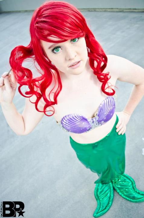 1girl breasts cosplay female from_above long_hair red_hair solo tagme the_little_mermaid