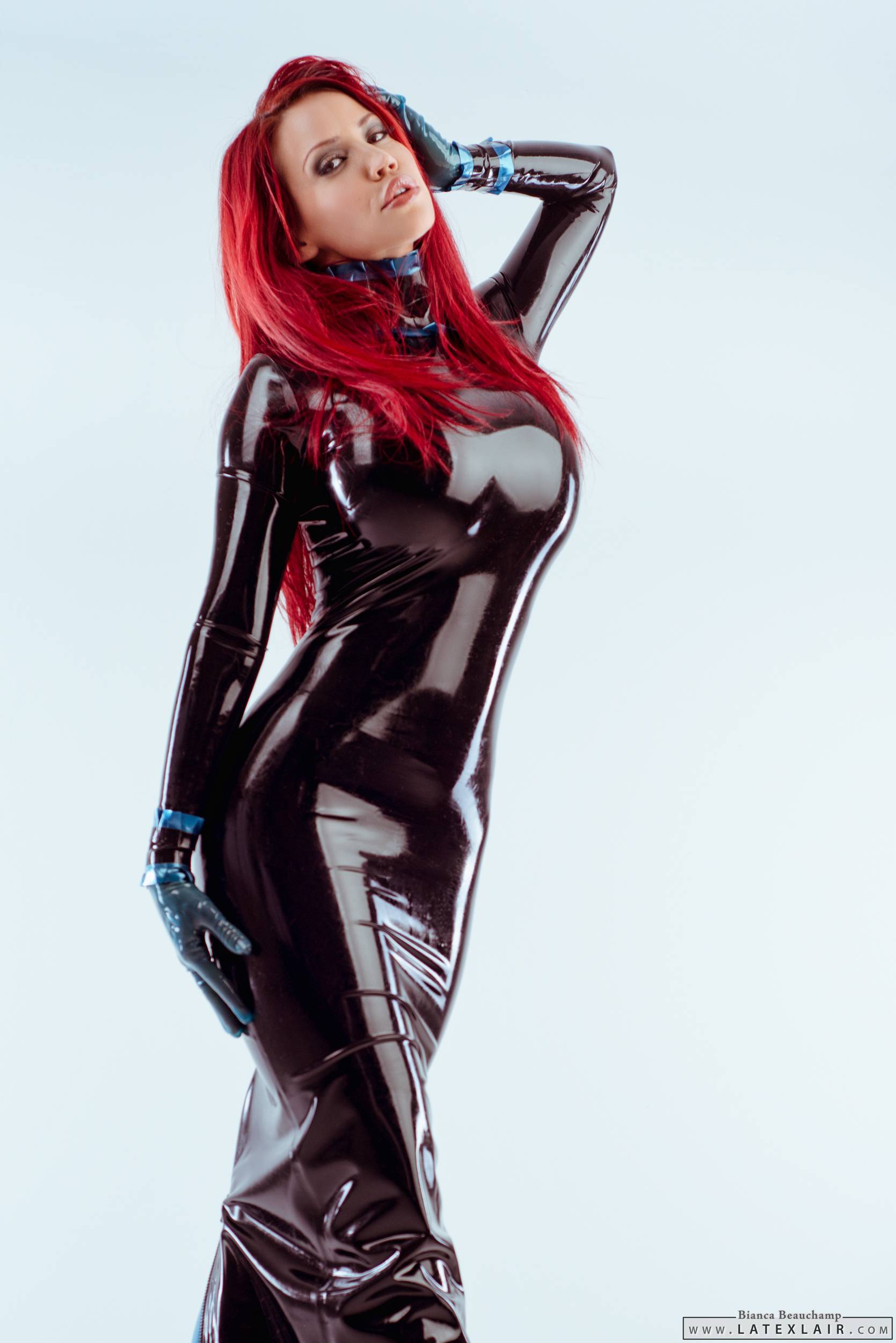 bianca_beauchamp breasts dress female gloves large_breasts latex long_hair red_hair simple_background solo