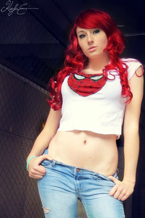 breasts cosplay female jeans kayla_erin large_breasts long_hair marvel mary_jane_watson midriff navel red_hair shirt solo