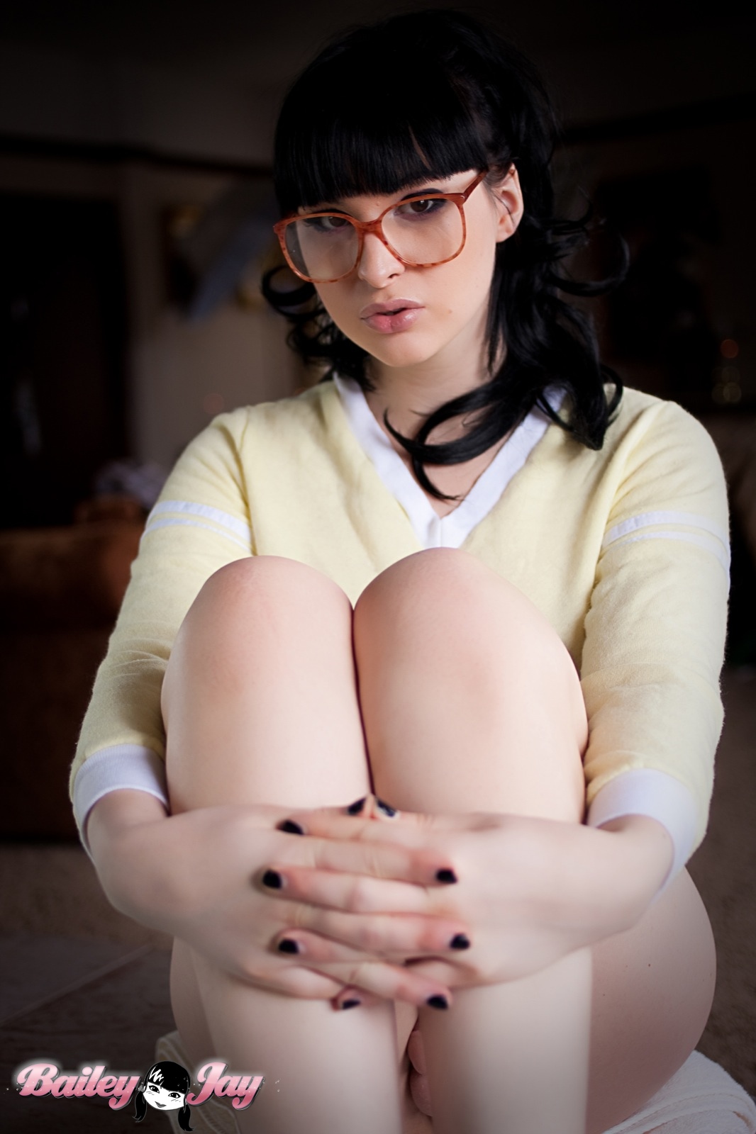 bailey_jay balls black_hair bottomless breasts covering_crotch glasses large_breasts long_hair looking_at_viewer nail_polish penis porn_star pursed_lips shemale solo transgender watermark white