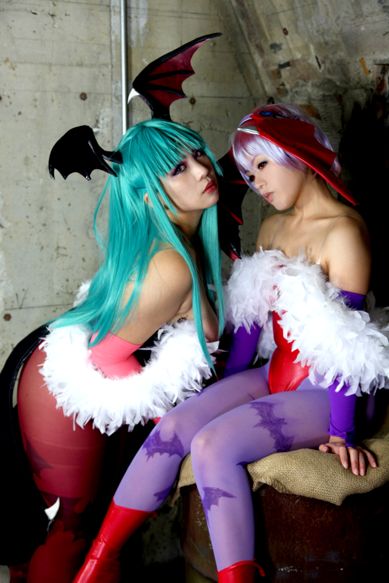 2girls aqua_hair ass bare_shoulders breasts chouzuki_maryou cleavage cosplay darkstalkers demon_wings female female_only high_heel_boots huge_breasts leotard lilith_aensland long_hair looking_at_viewer morrigan_aensland non-nude pantyhose partially_clothed plump purple_hair solo succubus suzuka_itsuki thong_leotard watermark wings