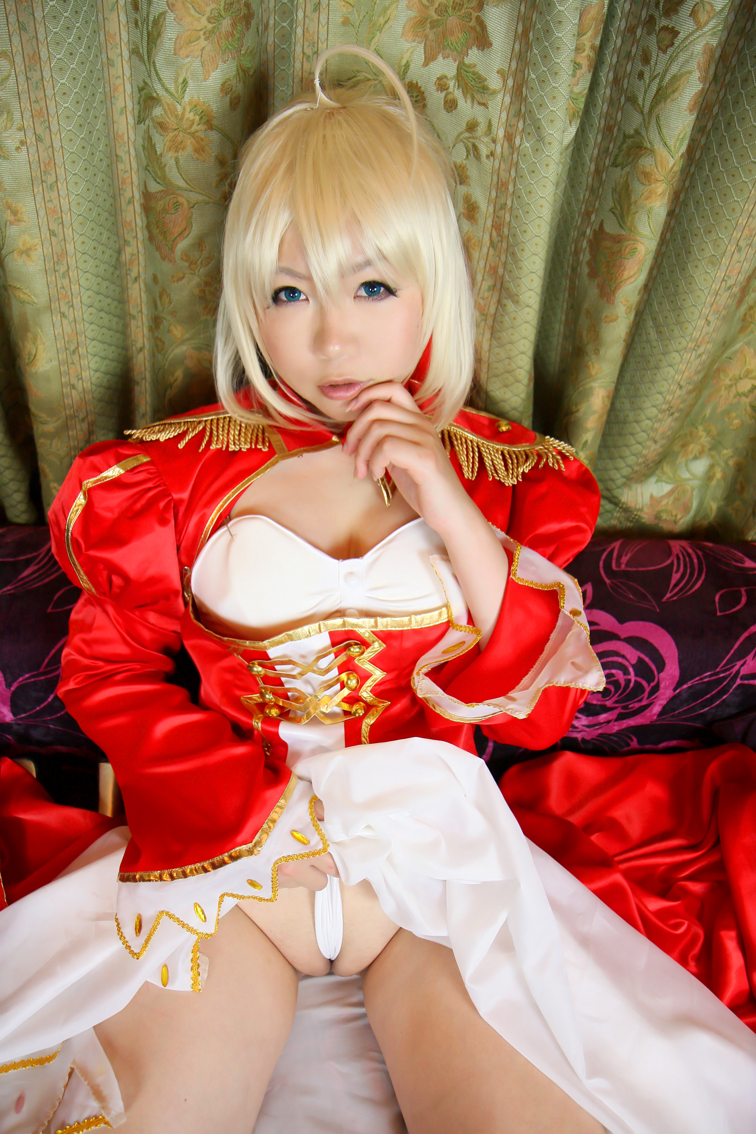 asian blonde_hair boots breasts cleavage cosplay dress female high_heels long_hair sitting sofa solo stairs sword
