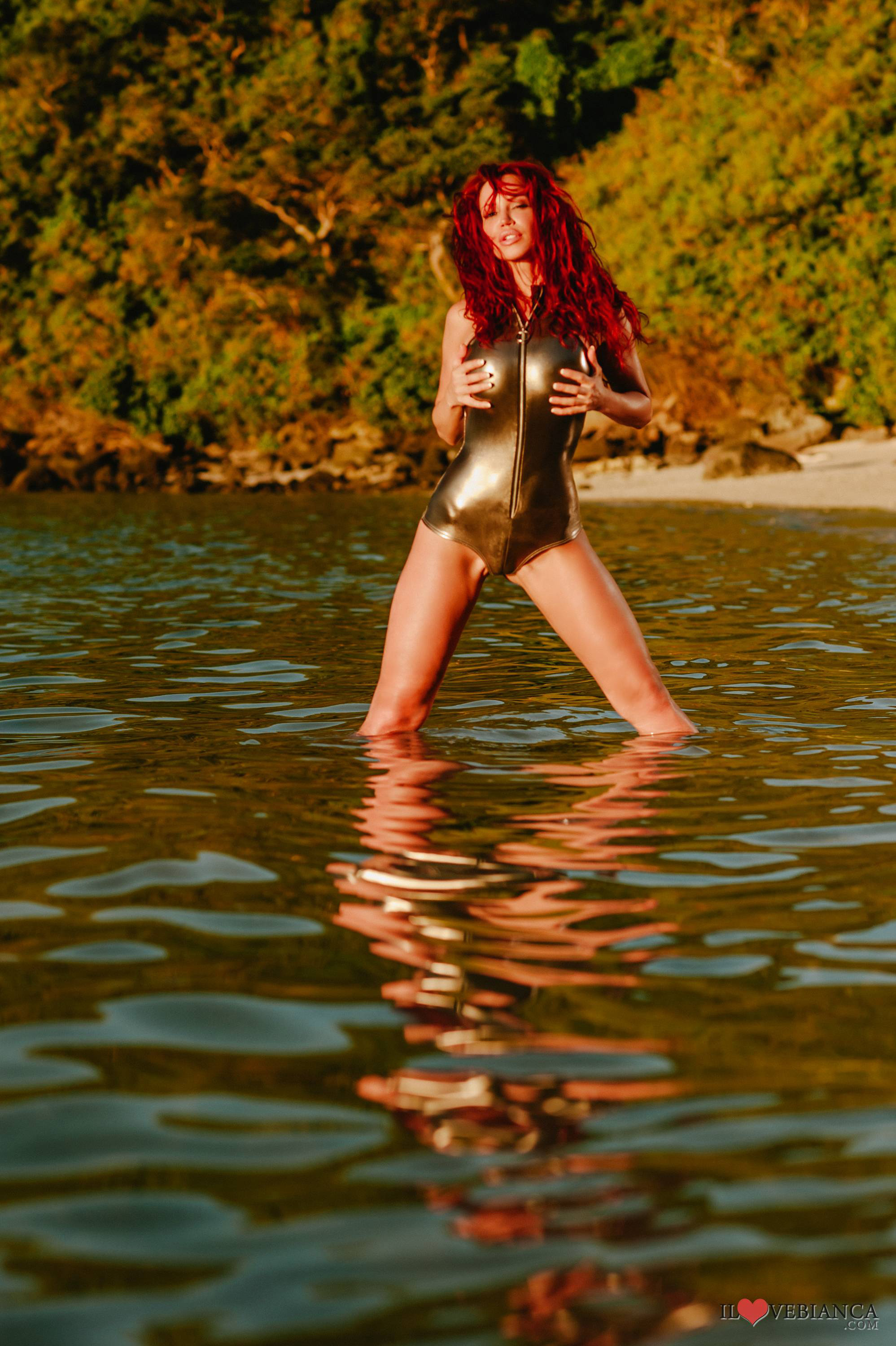 beach bianca_beauchamp breasts female large_breasts leotard long_hair outside red_hair solo water watermark wet