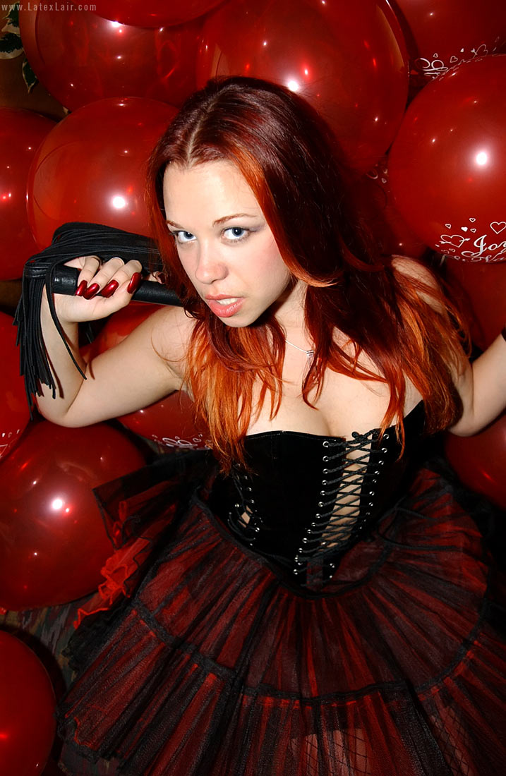 bianca_beauchamp breasts female large_breasts latex long_hair red_hair solo watermark