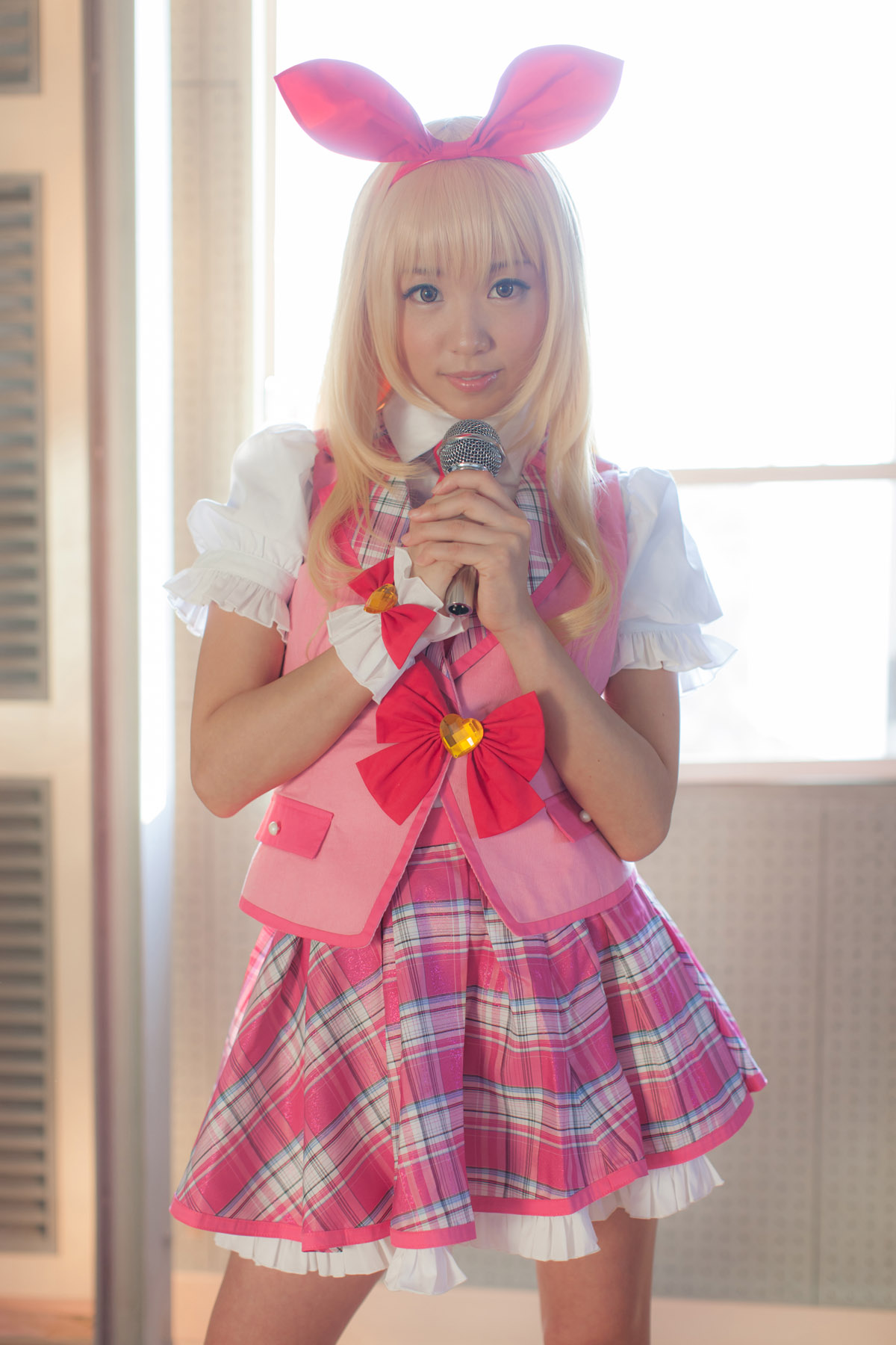 asian blonde_hair breasts cosplay female long_hair microphone shoes skirt solo