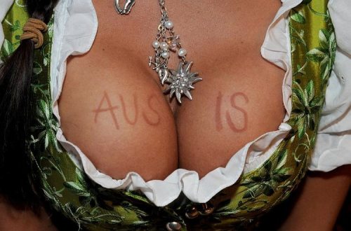 1girl bavaria breasts cleavage dirndl dress female german necklace oktoberfest solo text
