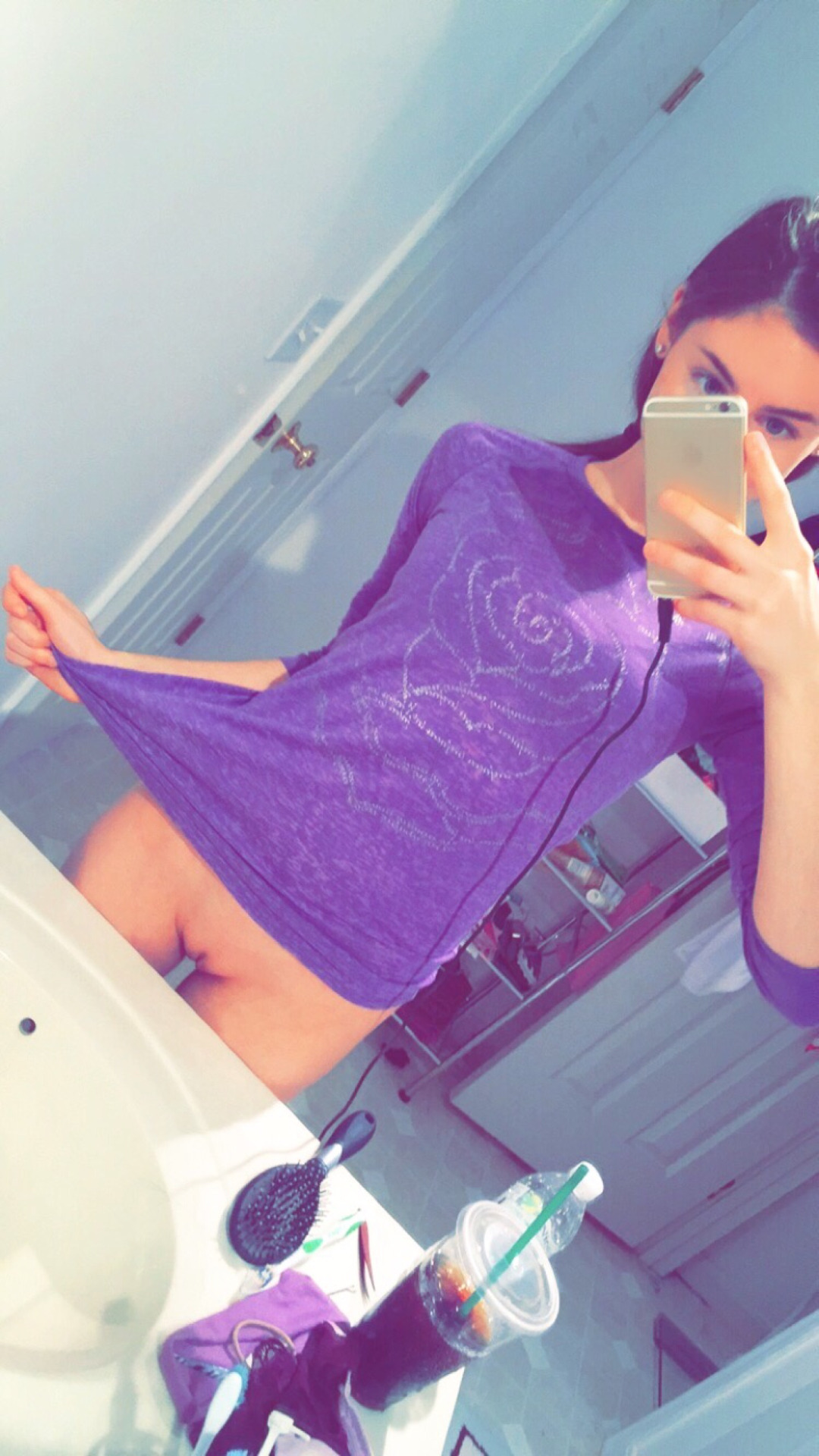 1girl amateur bathroom bottomless cellphone female female_only flower gap highres indoors mirror no_panties photo pulling pussy reflection selfie shirt shirt_pull solo standing