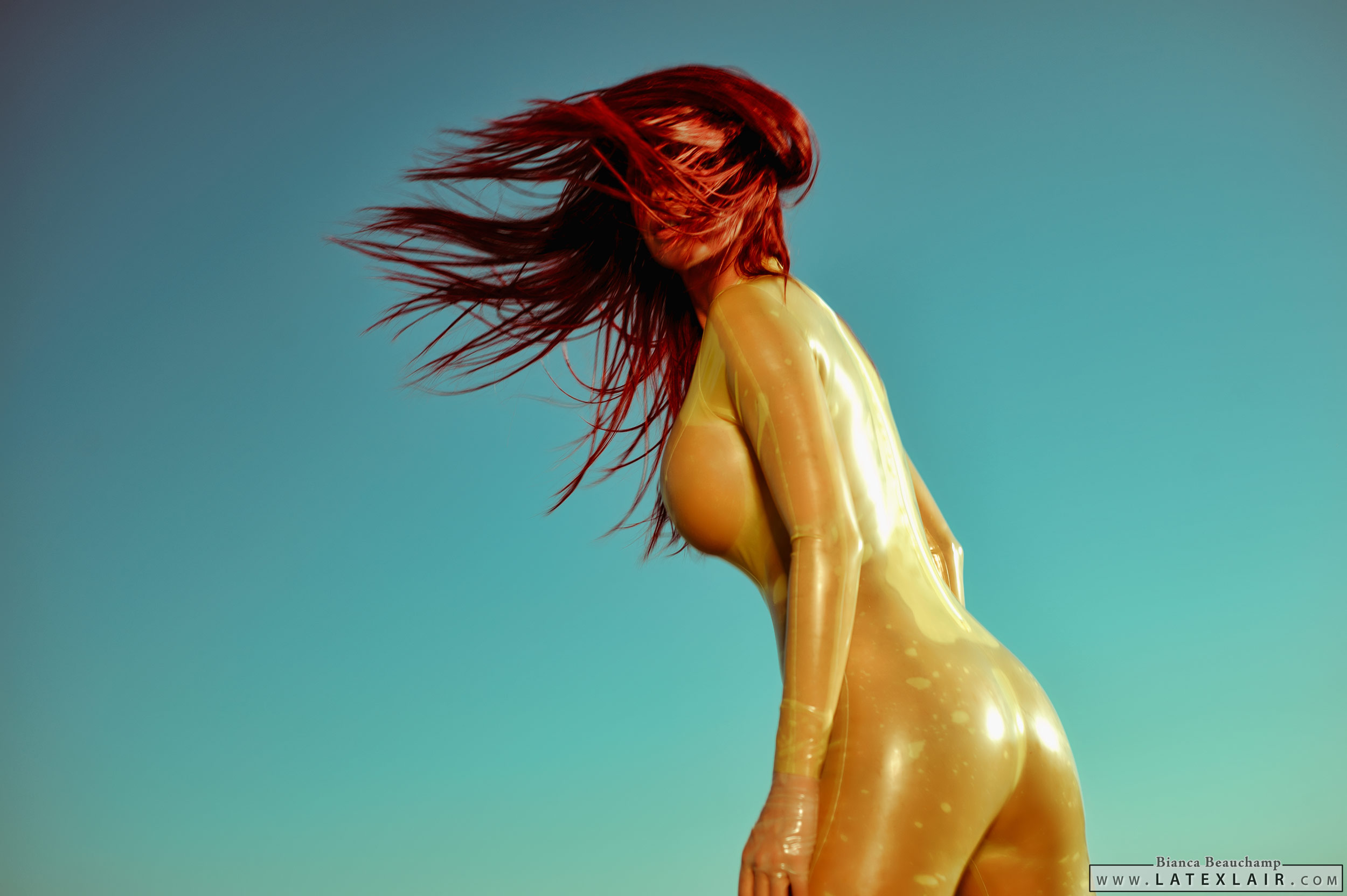 ass bianca_beauchamp breasts catsuit erect_nipples female gloves large_breasts latex long_hair looking_back nipples outside red_hair see-through solo watermark