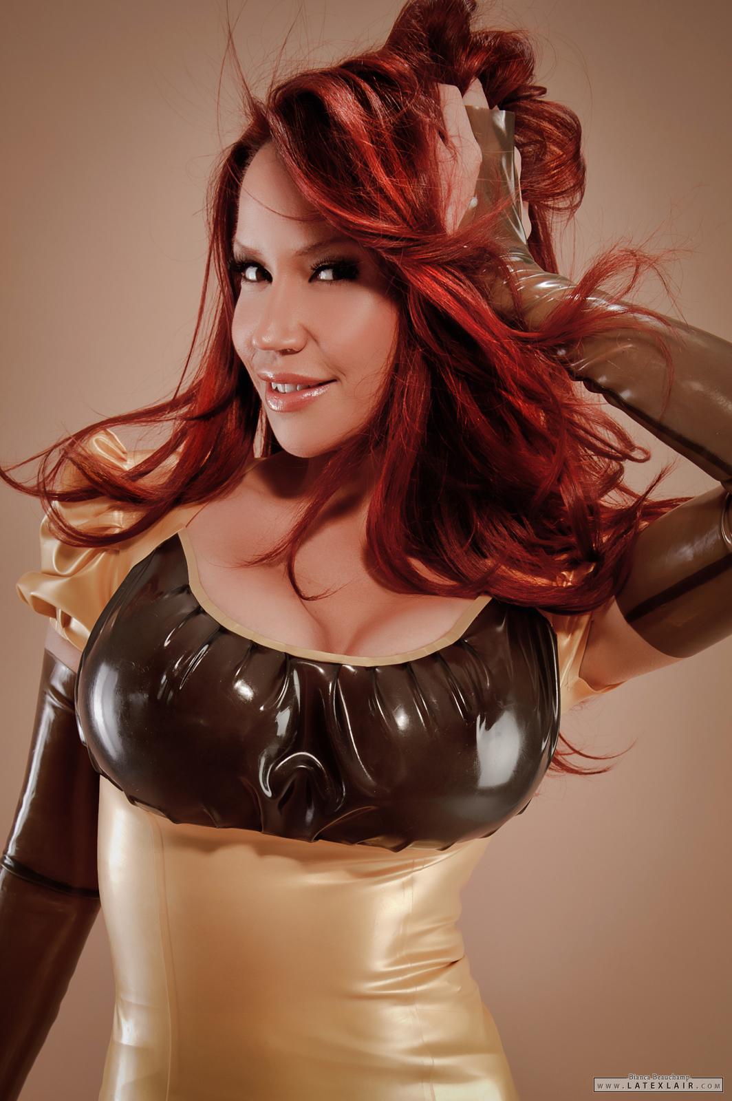 bianca_beauchamp breasts cleavage dress earrings female gloves large_breasts latex long_hair red_hair simple_background solo watermark