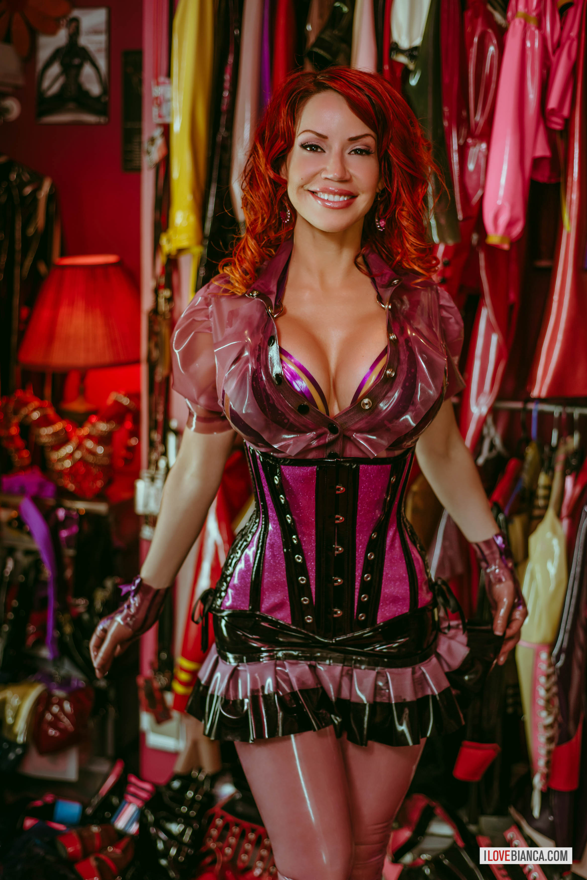 bianca_beauchamp boots bra breasts cleavage corset female high_heels large_breasts latex long_hair red_hair solo watermark
