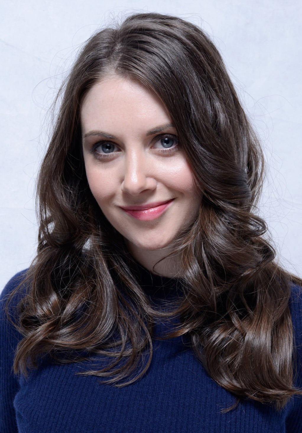 10_out_of_10 alison_brie ass blue_eyes breasts brown_hair clothed female long_hair looking_at_viewer smile