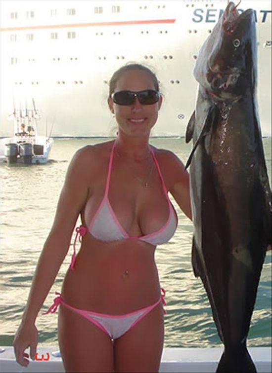 1girl bikini boat breasts female female_only fish glasses photo real_person solo