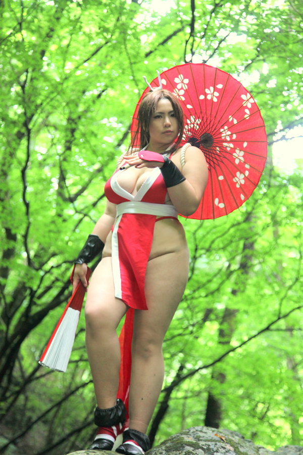 breasts brown_eyes brown_hair chouzuki_maryou cosplay fan female female_only hair_ornament king_of_fighters large_breasts long_hair mai_shiranui mai_shiranui_(cosplay) plump ponytail snk solo thick_thighs thighs tied_hair very_long_hair