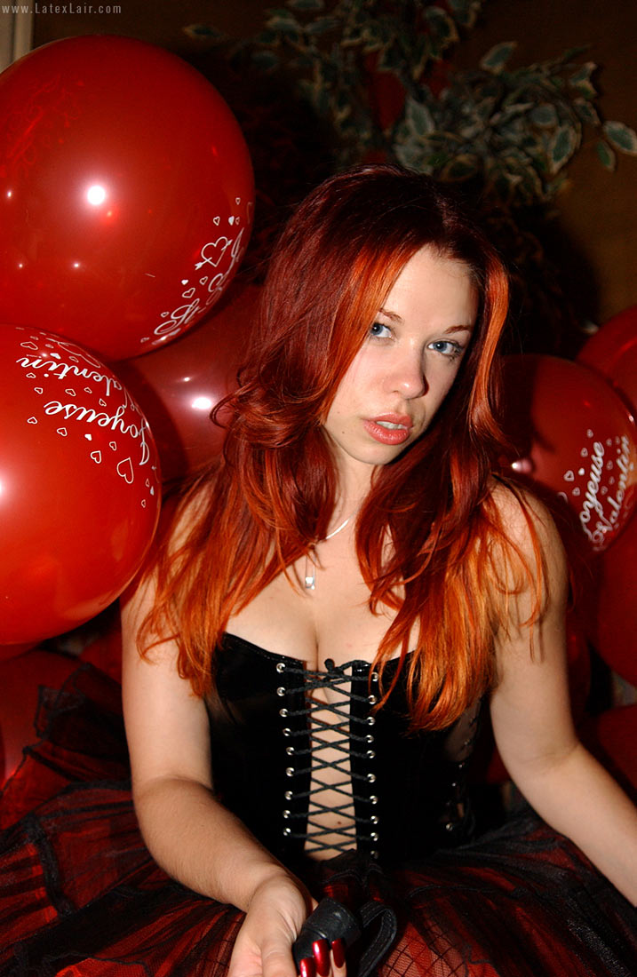 bianca_beauchamp breasts female large_breasts latex long_hair red_hair solo watermark