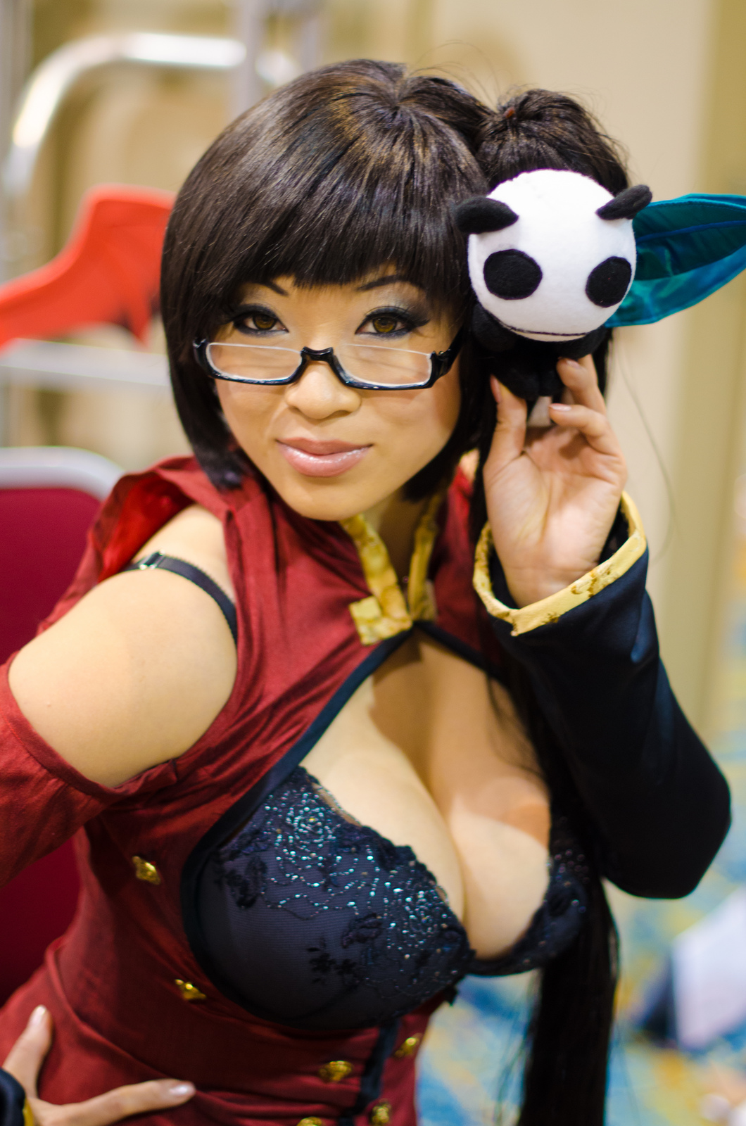 1girl asian blazblue bra breasts cleavage cosplay female glasses large_breasts leaning_forward litchi_faye_ling long_hair solo yaya_han