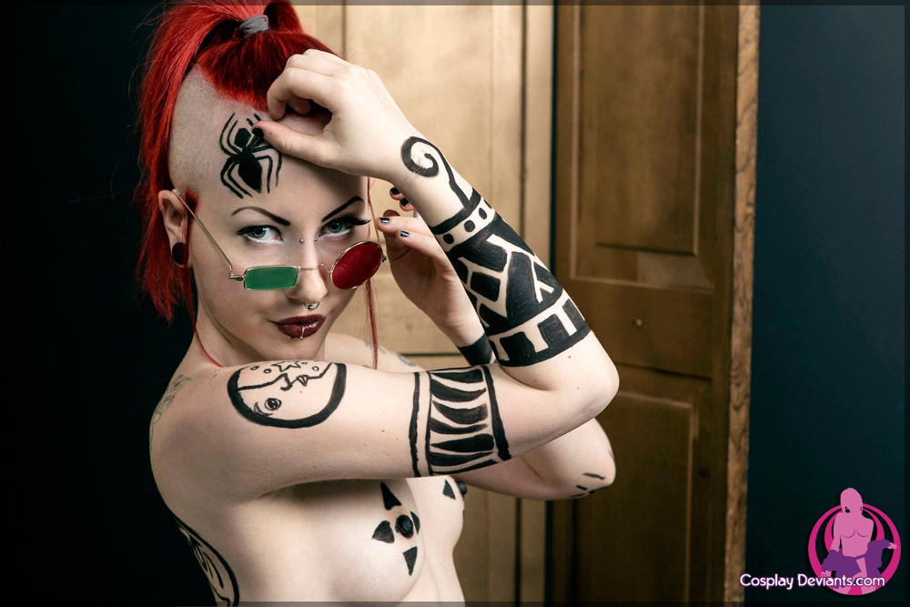 1girl body_paint breasts cosplay eye_con female glasses lip_piercing lipstick long_hair nose_piercing porphyria red_hair solo tattoo watermark
