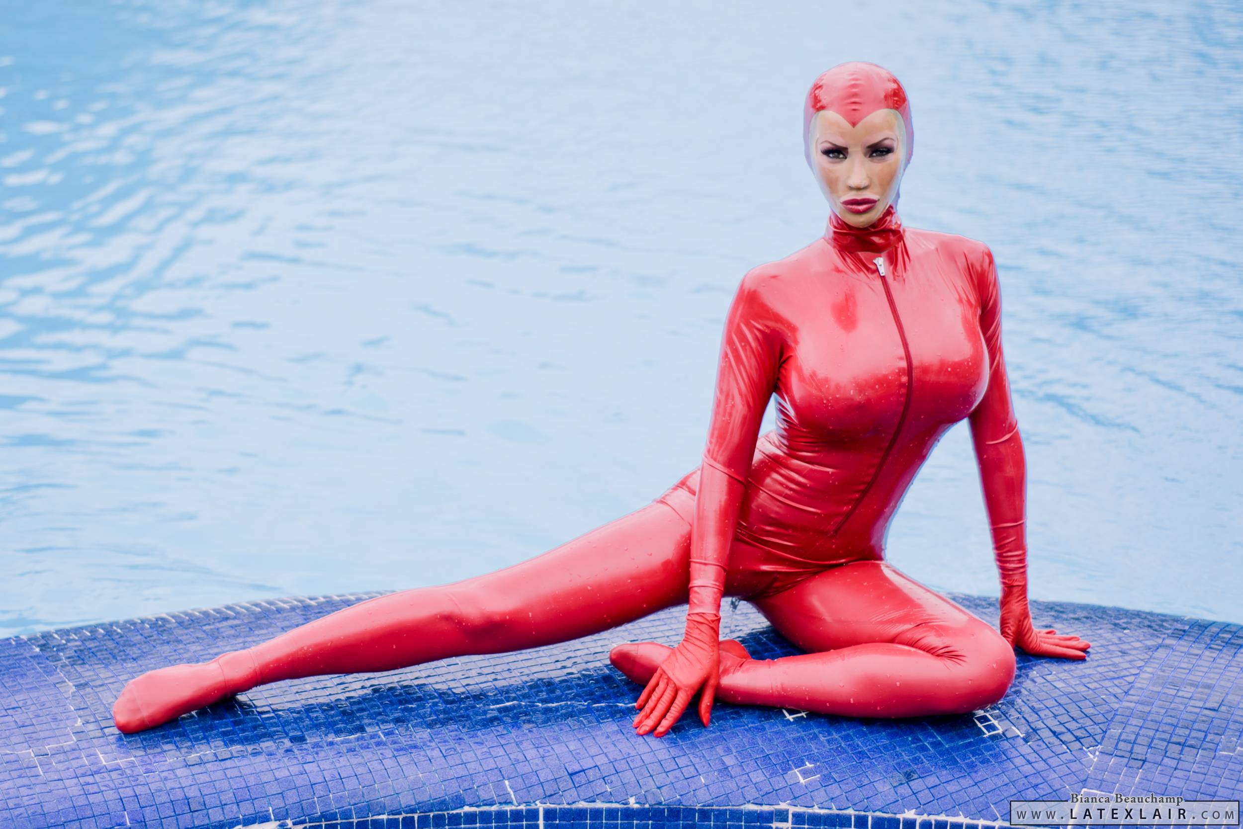bianca_beauchamp breasts catsuit female gloves large_breasts latex long_hair mask pool red_hair solo water watermark wet