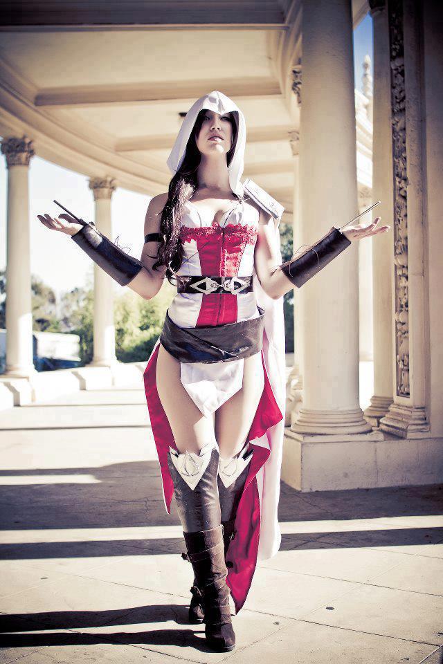 assassin assassin's_creed big_breasts boots breasts brown_hair cape cosplay hair hood long_hair photo weapon