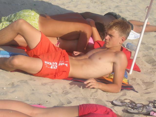 1boy beach making_out male photo real_person sand topless