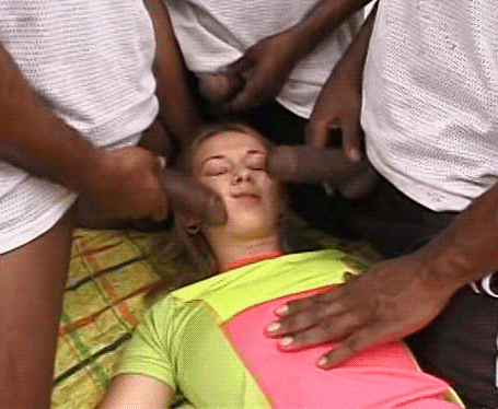 animated bbc blonde_hair blowbang clothed clothed_female dark-skinned_male dark_skin face foursome gif interracial lying multiple_boys penis penis_on_face skinny