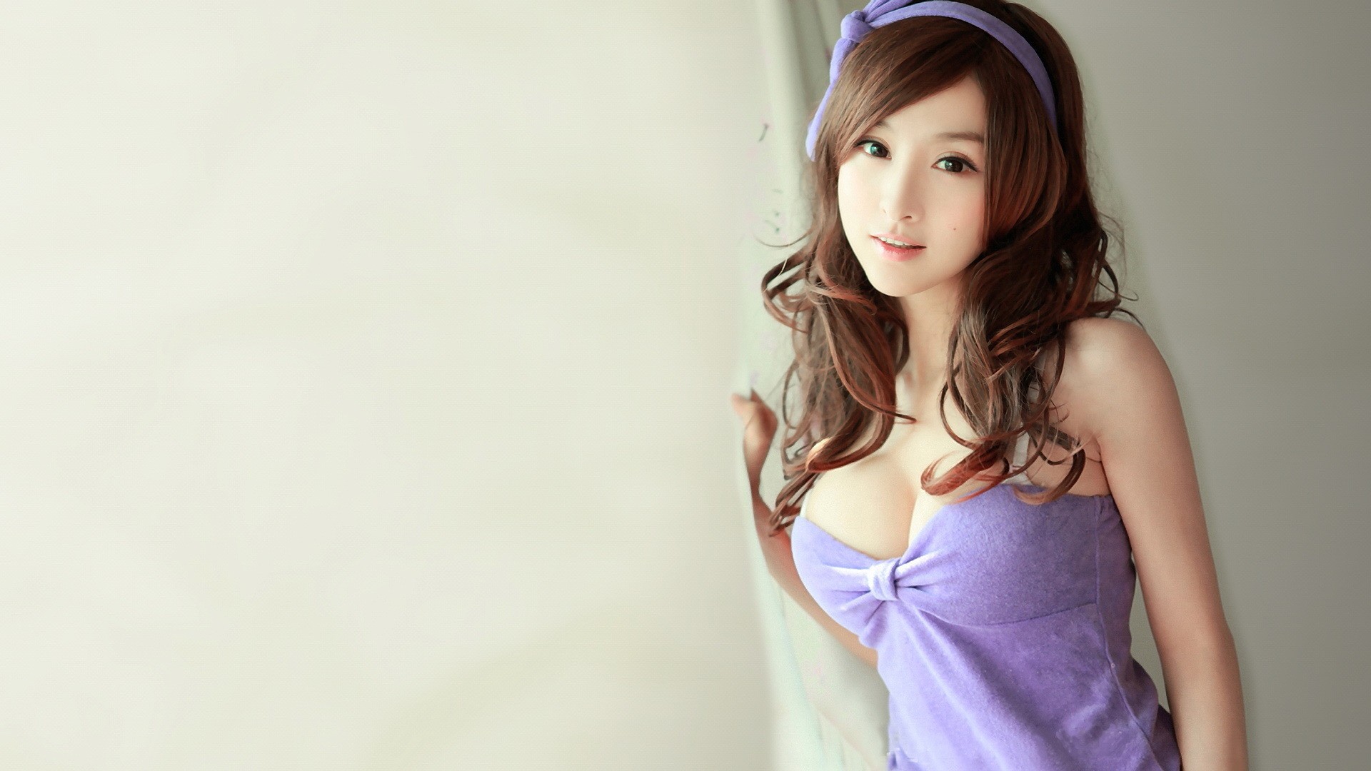 asian bra breasts brown_hair clothed female large_breasts long_hair simple_background smile solo