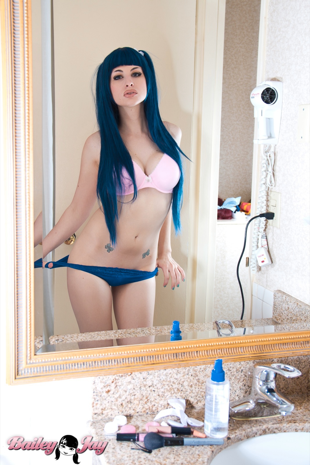 bailey_jay bathroom blue_hair breasts large_breasts long_hair mirror navel shemale solo tattoo watermark