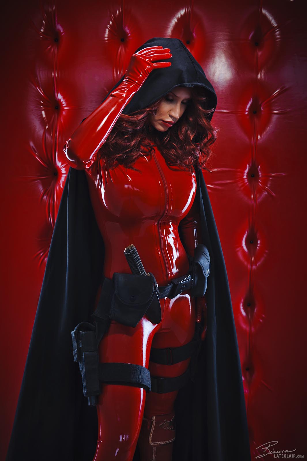 bianca_beauchamp bodysuit boots breasts cape female gloves gun high_heels hood knife large_breasts latex long_hair red_hair solo watermark weapon