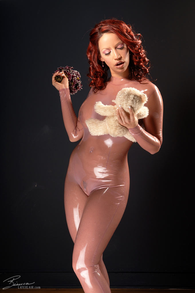 bianca_beauchamp breasts catsuit female large_breasts latex long_hair red_hair solo watermark