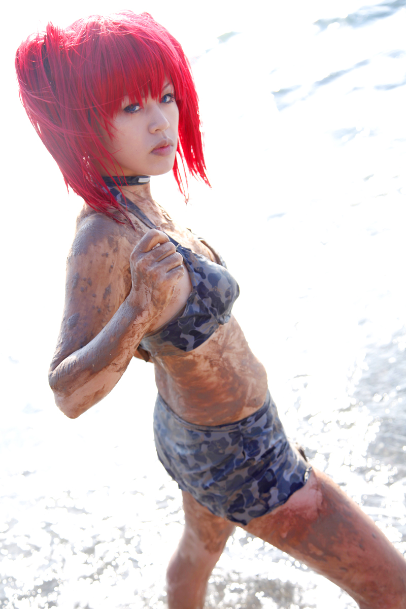 beach bra breasts camouflage_print choker female long_hair midriff mud necklace outside pigtails red_hair skirt small_breasts solo water
