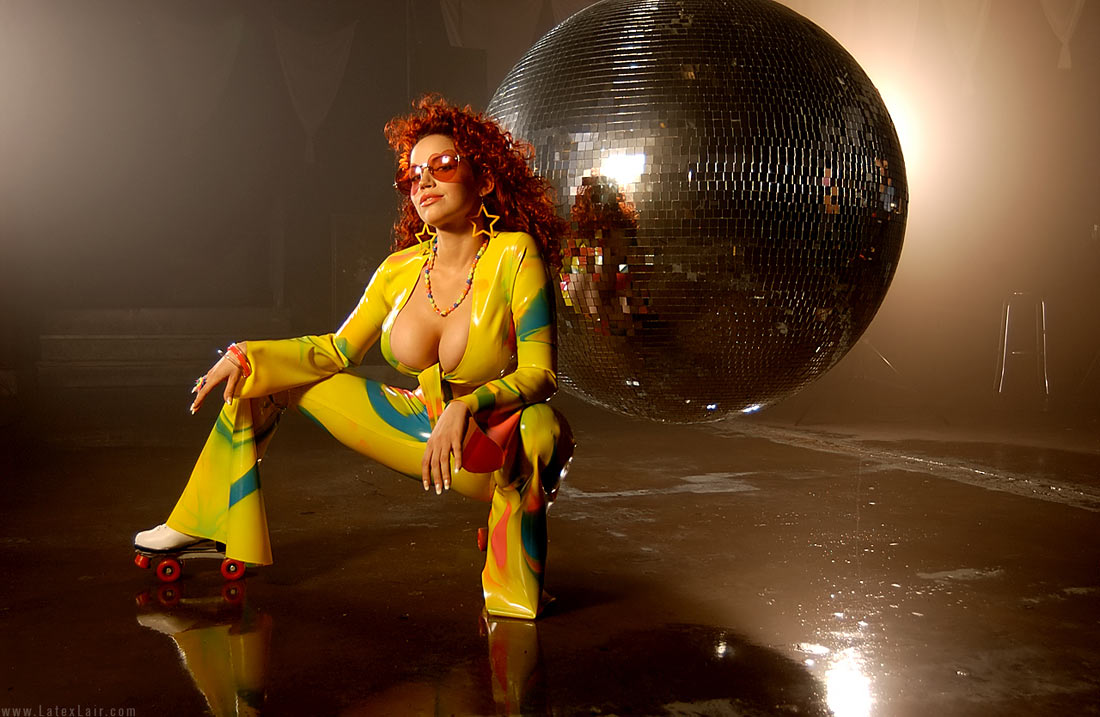 bianca_beauchamp breasts cleavage disco_ball earrings female large_breasts latex long_hair red_hair solo sunglasses